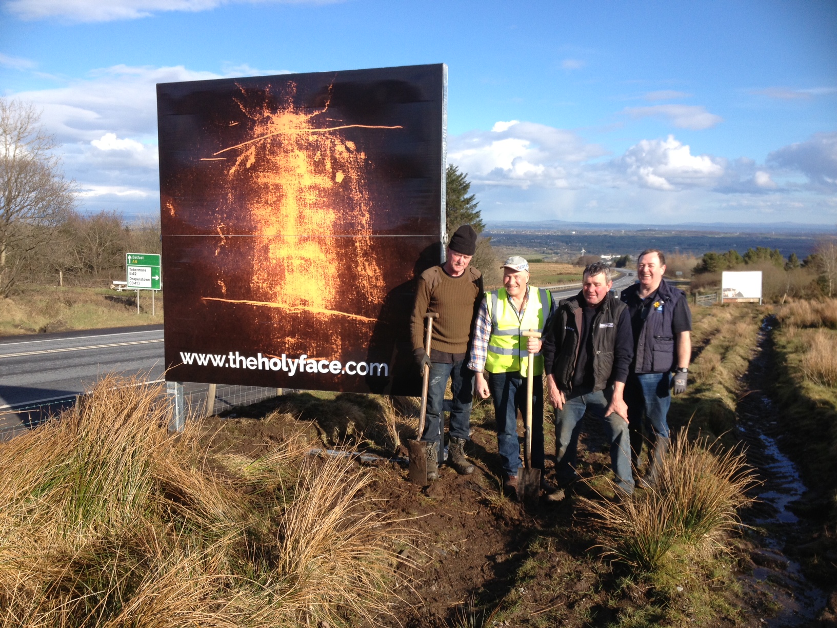 Permanent Holy Face of Jesus billboard on the main Belfast to Derry road